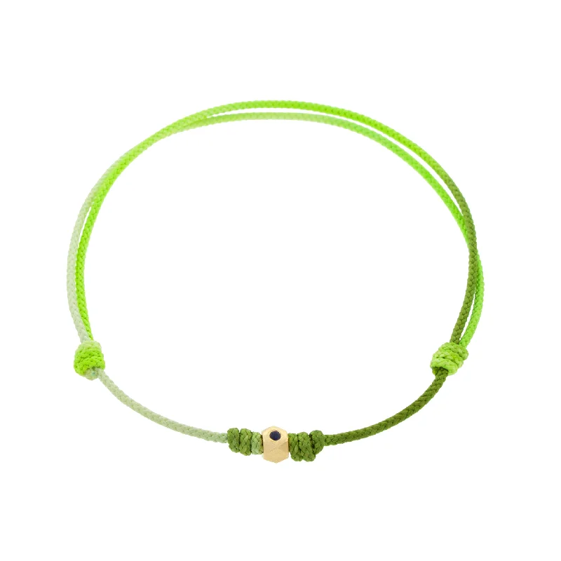 Flat Tetra with Blue Sapphire on a Green Ombre Cord Bracelet