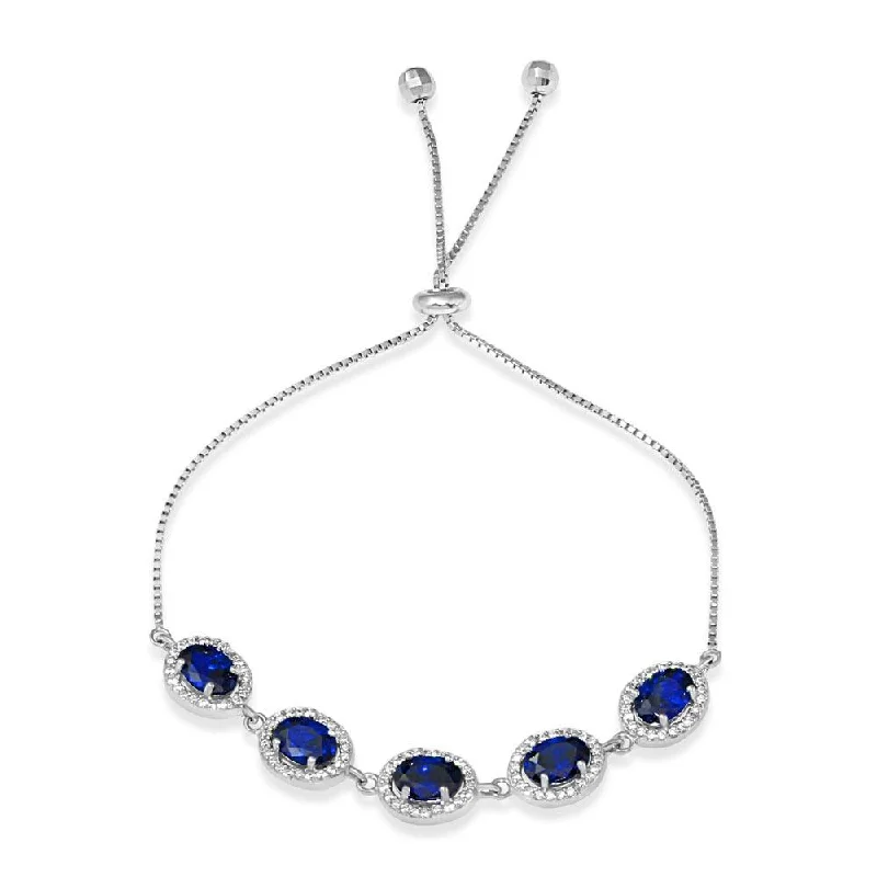 Rhodium Plated 925 Sterling Silver 5 Micro Pave Blue Oval and Clear Round CZ Lariat Bracelet - STB00548BLU